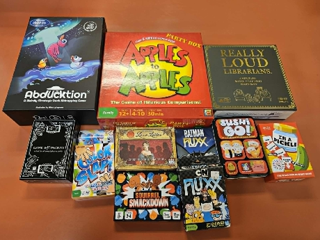 Assorted table top games including Apples to Apples, Fluxx, Sushi Go and more.