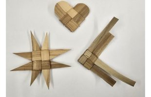 3 different shaped ornaments weaved from lau niu on a white background