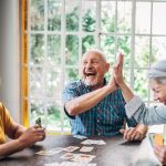 Adults playing a card game