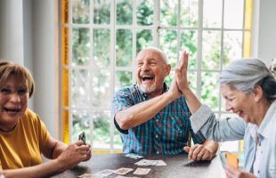 Adults playing a card game