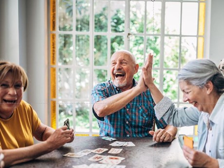 Adults playing a card game