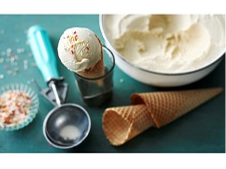 vanilla ice cream with scoop, cones, and sprinkles
