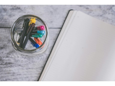 A blank journal and pens