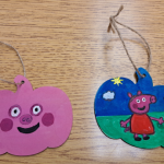 2 wooden pumpkins painted.