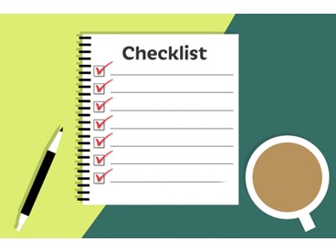 Checklist with pen and coffee