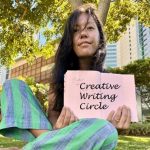 photo of woman sitting on grass