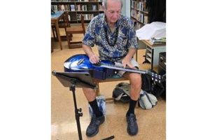 Daniel Tremblay playing Hawaiian Steel guitar at Waikīkī-Kapahulu Library