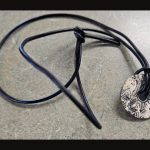 Necklace with charm.