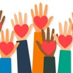 hands raised in the air with hearts on the palm of each hand