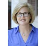 Woman's portait with glasses, short blond hair