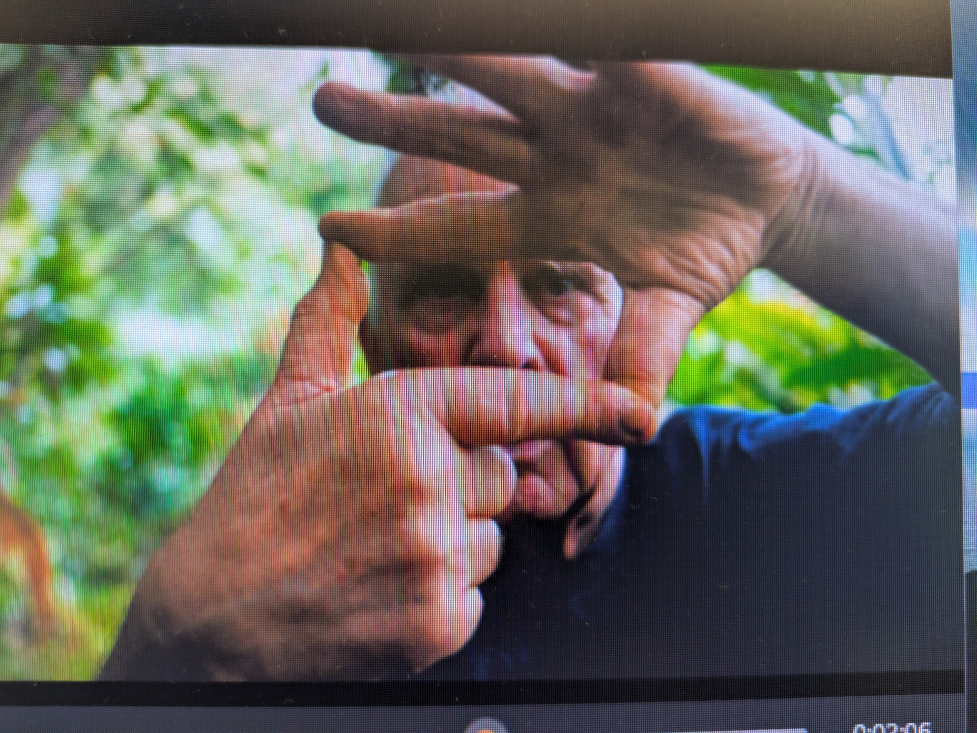 Man framing his face with his hands with a screen overlay