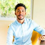 smiling man sitting in a chair