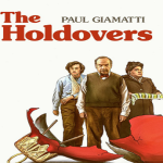 Two teachers and a student standing together.