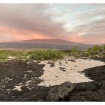 Hualalai volcano behind beach in Kailua-Kona Hawaii