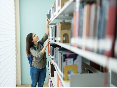 teen looking for a book on the top shelf