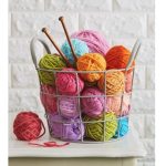 bucket of yarn of various colors