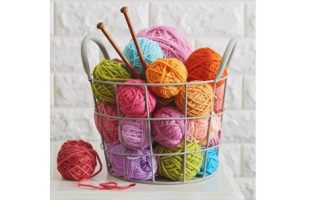 bucket of yarn of various colors