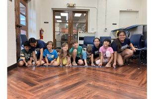 kids lined up to race brush bots