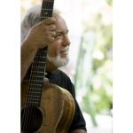 Musician John Keawe, profile picture, holding guitar