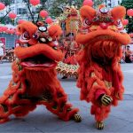 Two lion dancers.