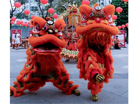 Two lion dancers.
