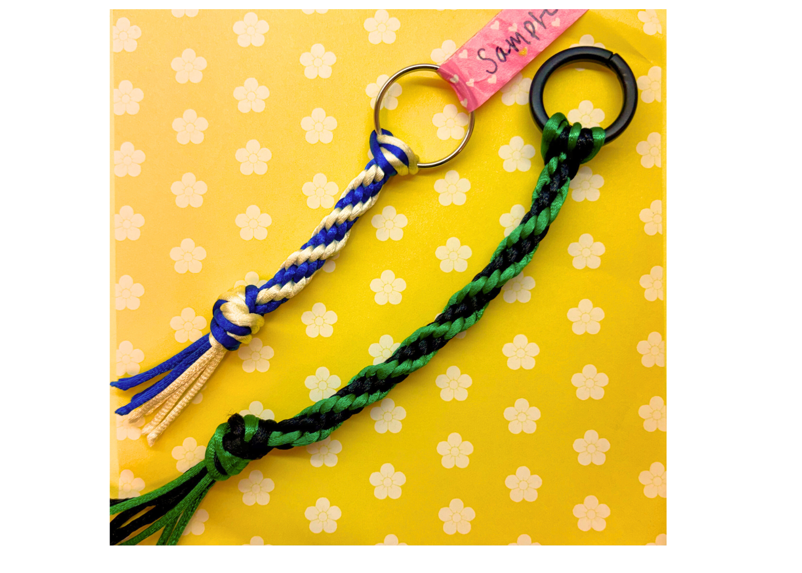 two Japanese braided cords against a yellow backdrop