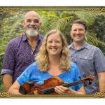 three musicians with trees in background