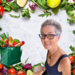 Fresh vegetables as a background with a woman in glasses in the foreground