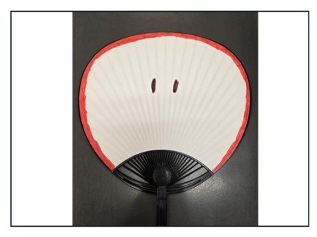 fan decorated to look like an apple