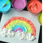 Puffy paint rainbow with four jars of paint above it.