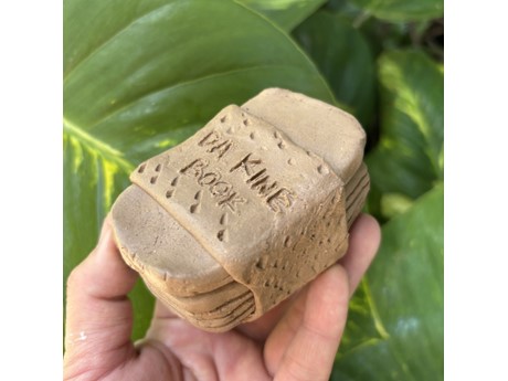 ceramic musubi book labelled da kine book