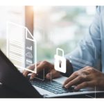 laptop open with hands on keyboard