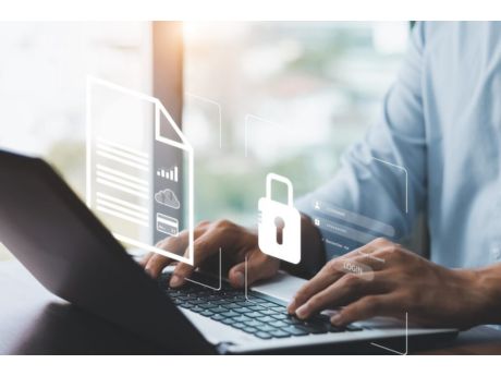 laptop open with hands on keyboard