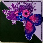 Purple corner bookmark decorated with tiny jewels in a butterfly pattern