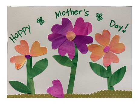 collage with orange and pink painted papers shaped as flowers and the words "Happy Mother's Day"