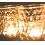Two tealights lit in jars