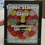 Faux stained glass picture of a bee in a black frame.