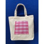 totebag with pink flannel design in the middle