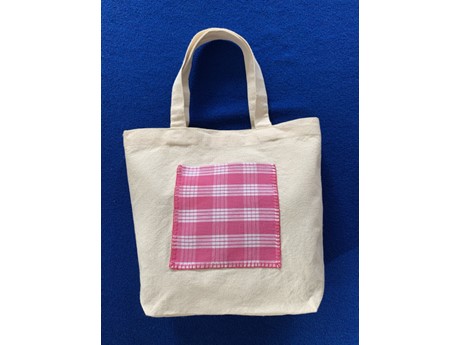 totebag with pink flannel design in the middle
