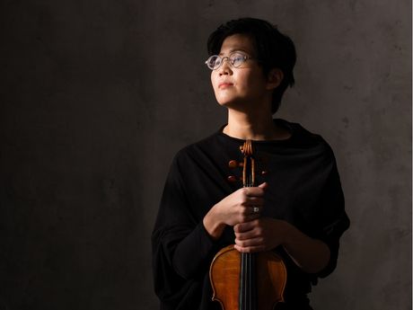 violinst Clara Kim holding violin