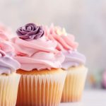 Vanilla cupcakes with pink and purple piped icing