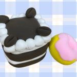 Chocolate layer cake and frosted donut made out of air dry clay