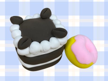Chocolate layer cake and frosted donut made out of air dry clay