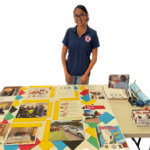 woman standing behind a table
