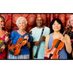 5 musicians, 4 women, one man, each holding instruments including violin, cello, clarinet, in front of red background