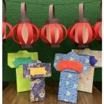 Black and red lanterns are shown along the top of the image. Four colorful yukata are displayed under.