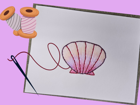 a white card with embroidered seashell, needle, and thread
