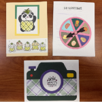 3 handmade cards: panda dressed as pineapple, wheel with fruit, and camera