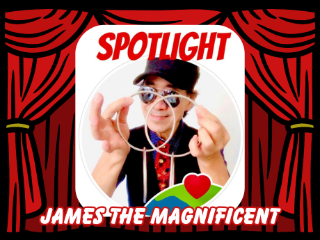 Magician with red curtain stage behind them