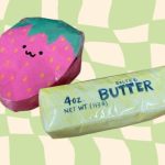 A pink strawberry squishy and a butter squishy made out of paper